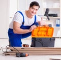 Young worker working on floor laminate tiles Royalty Free Stock Photo