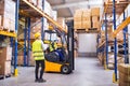 Young warehouse workers working together. Royalty Free Stock Photo