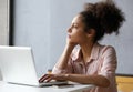 Young working woman looking out window Royalty Free Stock Photo