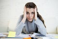 Young worried woman suffering stress doing domestic accounting paperwork bills Royalty Free Stock Photo