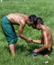 A young wrestler consoles his opponent after victory at the Kirkpinar Turkish Oil Wrestling Festival in Edirne, Turkey.