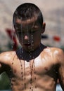 A young wrestler cools off after competing at the Elmali Turkish Oil Wrestling Festival in Elmali in Turkey.