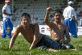 A young wrestler raises his arm in victory at the Elmali Turkish Oil Wrestling Festival in Turkey.