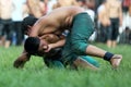 Young wrestlers battle for victory during competition at the Kirkpinar Turkish Oil Wrestling Festival in Edirne in Turkey.