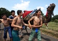 Young wrestlers enjoy the appearance of a camel at the Velimese Turkish Oil Wrestling Festival in Turkey.