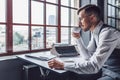 Young writer drinking coffee indoors Royalty Free Stock Photo