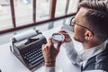 Young writer drinking coffee Royalty Free Stock Photo