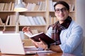 The young writer working in the library Royalty Free Stock Photo