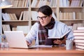 The young writer working in the library Royalty Free Stock Photo