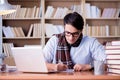 The young writer working in the library Royalty Free Stock Photo