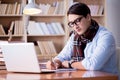 The young writer working in the library Royalty Free Stock Photo