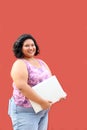 20 year old overweight brunette Latina woman uses her laptop to study, do homework, date, shop online and chat with her friends