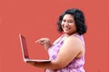 20 year old overweight brunette Latina woman uses her laptop to study, do homework, date, shop online and chat with her friends