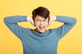 Young yelling man hand cover his ear Royalty Free Stock Photo