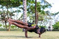 Young yoga man practitioners doing yoga on nature. Asian indian yogis man on the grass in the park. Bali island. Royalty Free Stock Photo