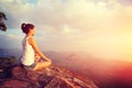 Young yoga woman at sunrise