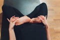 Young yogi attractive woman practicing yoga concept, standing in salamba sirsasana exercise, headstand pose, working out Royalty Free Stock Photo