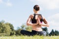 young yogini in Reverse Prayer Pose practicing