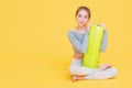 Young yogini woman before yoga glass