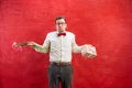 Young young funny man with flowers and gift Royalty Free Stock Photo