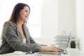 Younger girl working in the office at the table