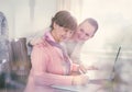 Younger woman helping an elderly person using laptop Royalty Free Stock Photo