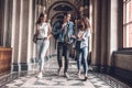 Youngs and beautiful. Group of confident students are walking in the college,chatting and smiling Royalty Free Stock Photo