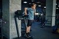 Youngster doing ABS exercise on machine in gym