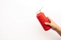 Youngwoman hand squeezing bottle of tomato sauce ketchup on white background Royalty Free Stock Photo