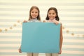 Your advertisement in good hands. Girls kids hold advertisement poster copy space. Children hold advertising banner Royalty Free Stock Photo