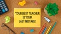 Your best teacher is your last mistake. Inspirational motivating quote on notebook