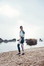 Your body can stand almost anything. Back view of young disabled athlete woman in sportswear with prosthetic leg is Royalty Free Stock Photo