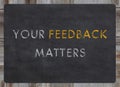your feedback matters sign - white chalk text on a vintage slate blackboard Royalty Free Stock Photo
