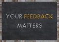 your feedback matters sign - white chalk text on a vintage slate blackboard Royalty Free Stock Photo