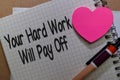 Your Hard Work Will Pay Off write on a book isolated on Office Desk Royalty Free Stock Photo