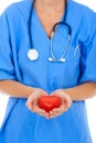 Your heart is in good hands. Closeup of a surgeon holding a heart in her hands. Royalty Free Stock Photo