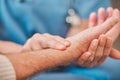 Your heartbeat is a bit fast. a nurse checking the pulse of her elderly patient. Royalty Free Stock Photo