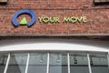 Your Move estate agents sign on the side of a brick building.  High street setting Royalty Free Stock Photo