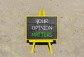 Your opinion matters symbol. Concept words Your opinion matters on beautiful black yellow blackboard. Beautiful sand beach Royalty Free Stock Photo