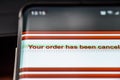 Your order has been cancelled text on smart phone screen