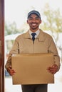 Your package has arrived. Portrait of a friendly delivery man delivering a box to a customers door.