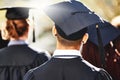 Your road starts here. Rearview shot of students on graduation day.