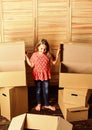 At your service. happy child cardboard box. repair of room. new apartment. happy little girl with bear toy. Cardboard Royalty Free Stock Photo