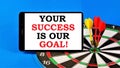 Your success is our goal. Text message on the background of a dartboard. Successful strategy in school and business, career