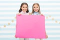 For your text. Happy children holding empty sheet of paper. Little children smiling with pink drawing paper. Small