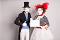 Your text here. Actors mimes holding empty blank board. Colorful studio portrait with gray background. April fools day Royalty Free Stock Photo