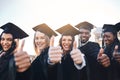 1. Your time as a caterpillar has expired. Your wings are ready.Portrait of a group of students showing thumbs up on Royalty Free Stock Photo