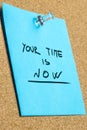 Your Time is Now Phrase on Pinned Sticky Note