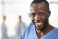 Your trusted companion in medical care. Portrait of a happy young man working as a surgeon in a hospital.