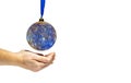 Your world is planet Earth. The globe, like a Christmas toy, hovering over women`s hands. Close-up, white isolated background, Royalty Free Stock Photo